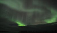 Aurora chasing in Finnish Lapland - dancing aurora over Lake Inari