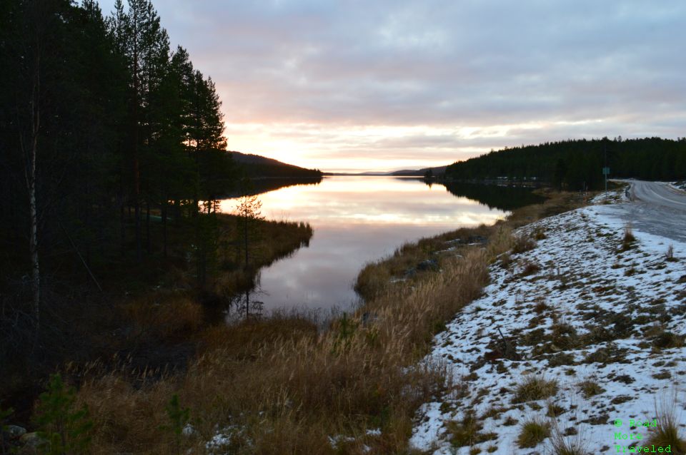 Sunrise on small lake near Inari, Finland